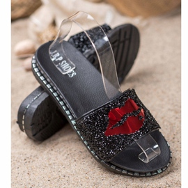 SHELOVET Svarta tofflor med applikation 1