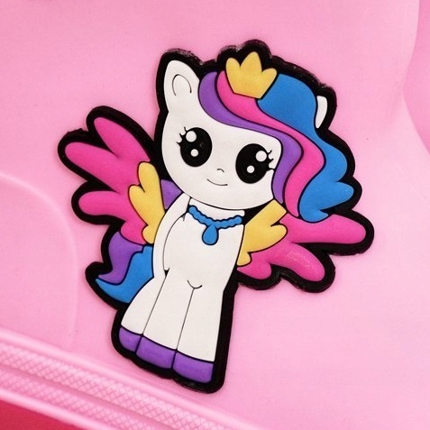 Barnens rosa galoscher med en ponny 1