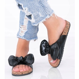 Svarta tofflor med rosett från Norris 1