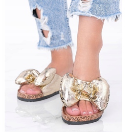 Guldtofflor med Norris rosett gyllene 1