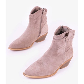 Gråbruna cowboystövlar på Bowi Bowi-stolpen 1