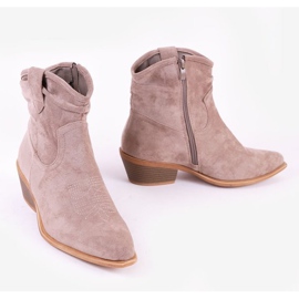 Gråbruna cowboystövlar på Bowi Bowi-stolpen 2