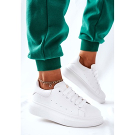 Läder sportskor på en vit Lemmy plattform 2