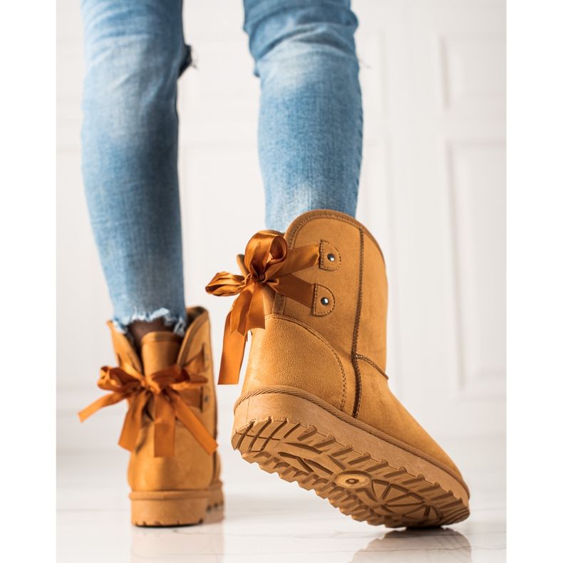 TRENDI Mukluki Med En Rosett gul 1