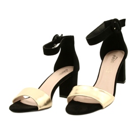 Svarta och guld sandaler på en klack Evento 20SD98-1617 gyllene 2