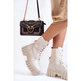 Sergio Leone Läder, isolerade stövlar på en ljusbeige Telisa-plattform 2