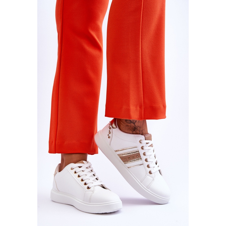 Sneakers i läder för kvinnor med dubbar i vitt och guld Dory 2