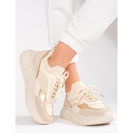 Kvinnors beige sneakers på en tjock sula Shelovet 1