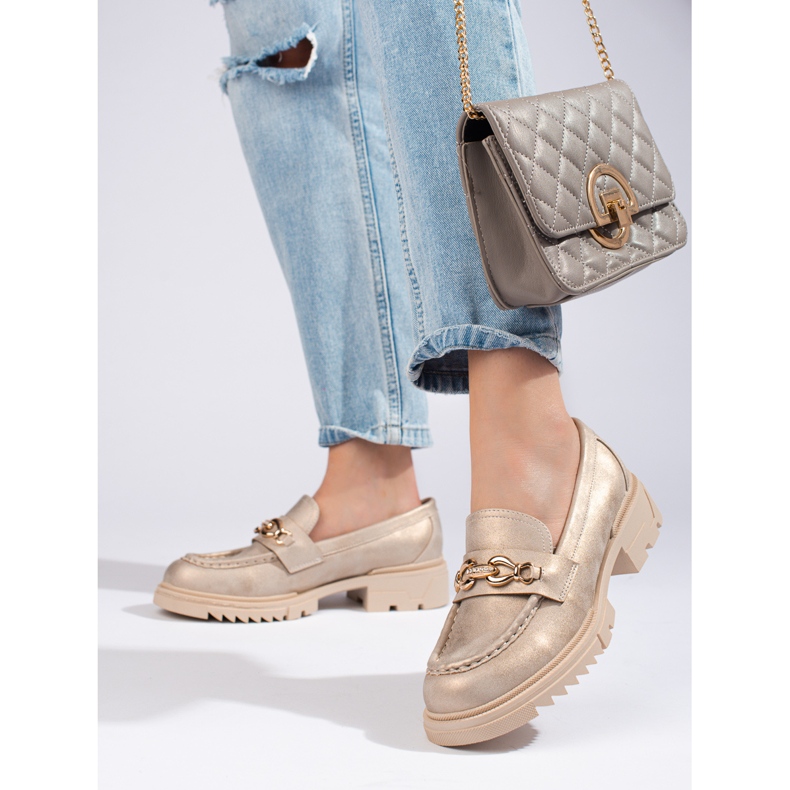 Gyllene brogues med Shelovet-utsmyckning 1